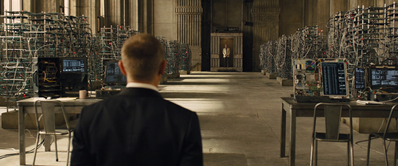 A screenshot from the movie 'Skyfall'. The character 'James Bond' is confronting the movie's villain for the first time.